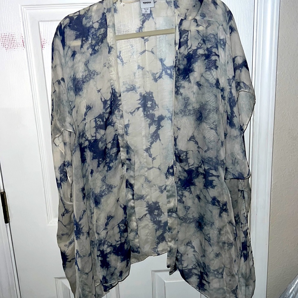 Cardigan great for those warm days has a tie closure